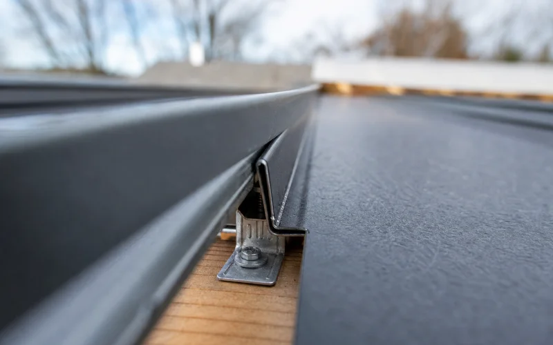 Detail of concealed fastener clip on a standing seam metal roof