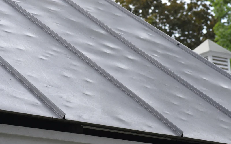 Hail-dented metal roof panel for honest disclosure context