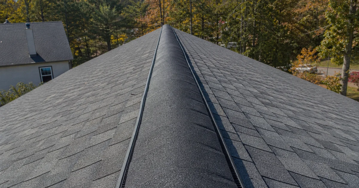 Ridge vent installed on a Connecticut architectural shingle roof, daylight close detail