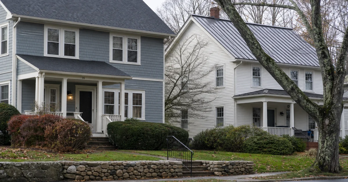 Side-by-side Connecticut homes: one with architectural asphalt, one with standing seam metal