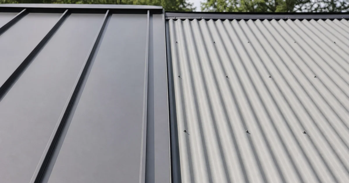 Side-by-side metal roof comparison: standing seam panels next to corrugated ribbed panels
